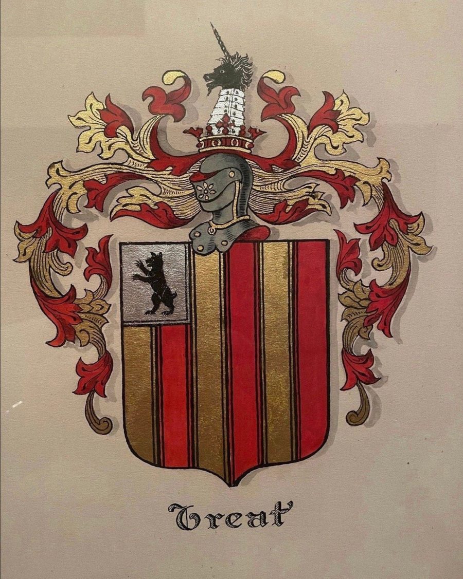 The Treat arms, painted: a shield of gold and red vertical stripes with a black bear in a silver canton, a helmet and crest above, and the name Treat beneath